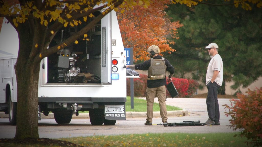 Members of the Dane County Bomb Squad prepare to enter Goodwill to remove a possible explosive device found among donated items. JNR photo by Dan Plutchak