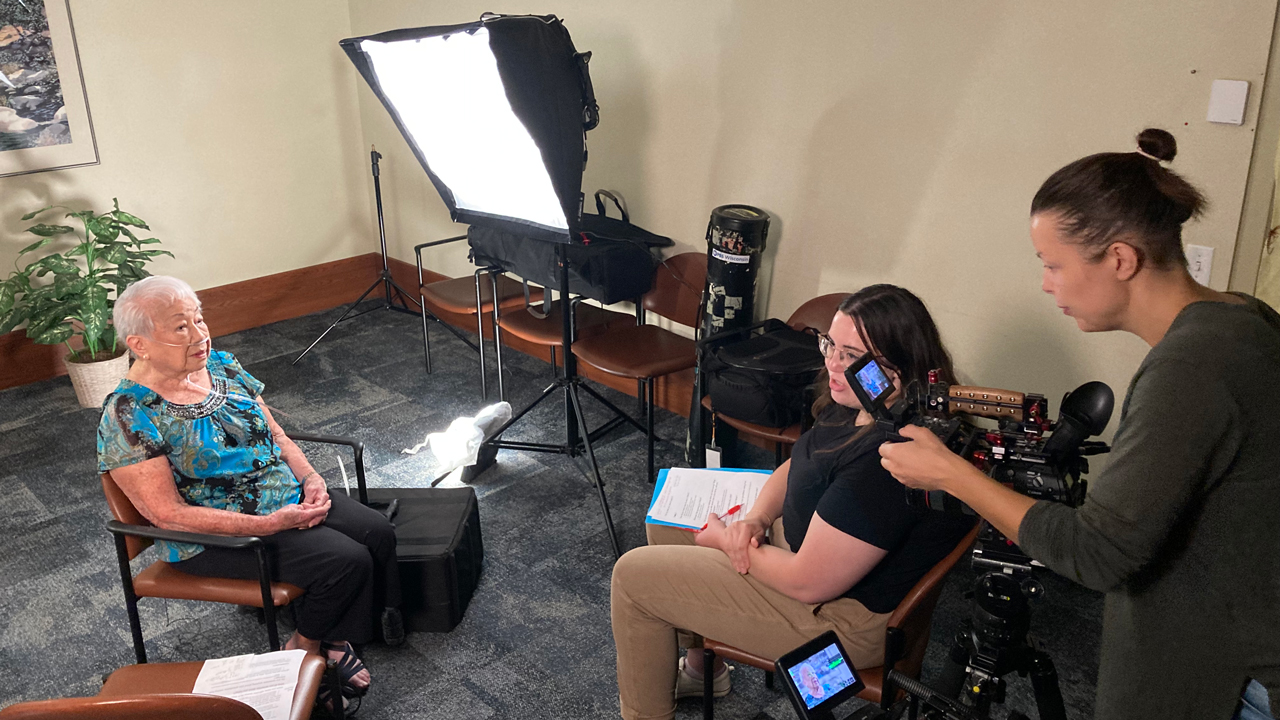 Producer Kyra Lyons and videographer Lina Soblyte interview lifelong Beloit resident Fung Scholz. PBS photo