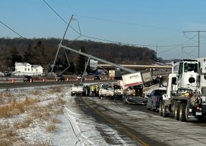 Trapped semi driver rescued after crashing into power pole along Interstate near Stoughton